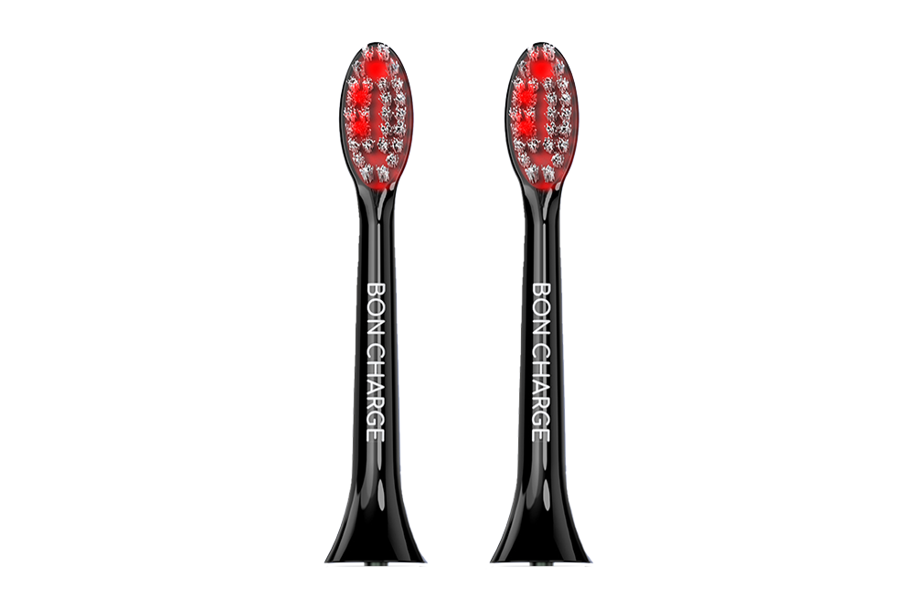 Black electric toothbrush head with red bristles