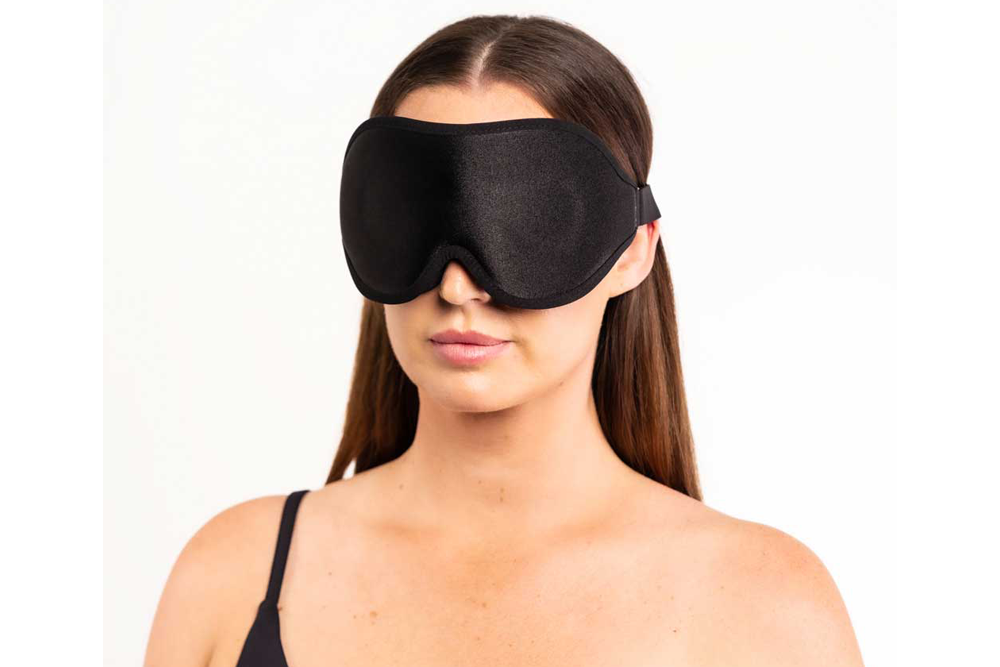 Woman Wearing Blackout Contoured Sleep Mask