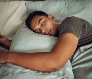 Man asleep with head on pillow